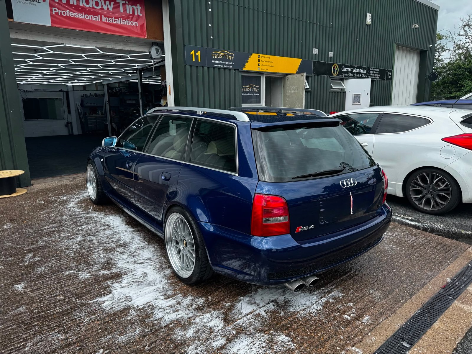 Car being valeted by hand at the Trust Tint workshop in Worcester
